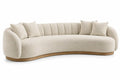 Sofá curvo tapizado de contorno redondeado, beige y marrón
